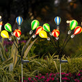 1. **HENLEY GLOWING SKYWARD ORBS - Solar-Powered Hot Air Balloon Luminaries (Set of 2)**  
   Illuminate your garden with whimsical floating orbs that harness solar energy, creating a magical ambiance.

2. **WILLOUGHBY AURORA AIRSHIP LIGHTS - Solar LED Ba