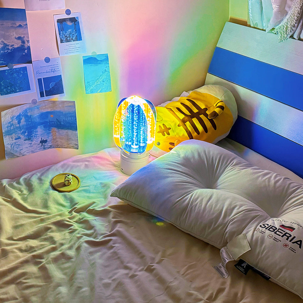 1. "VIVIENNE RAINBOW METAL TABLE LAMP"  
   A vibrant blend of colors and artistic design, this aluminum table lamp radiates warmth and creativity with its unique LED illumination.

2. "HAMPSTEAD ARTISANAL RAINBOW LAMP"  
   A striking fusion of color and