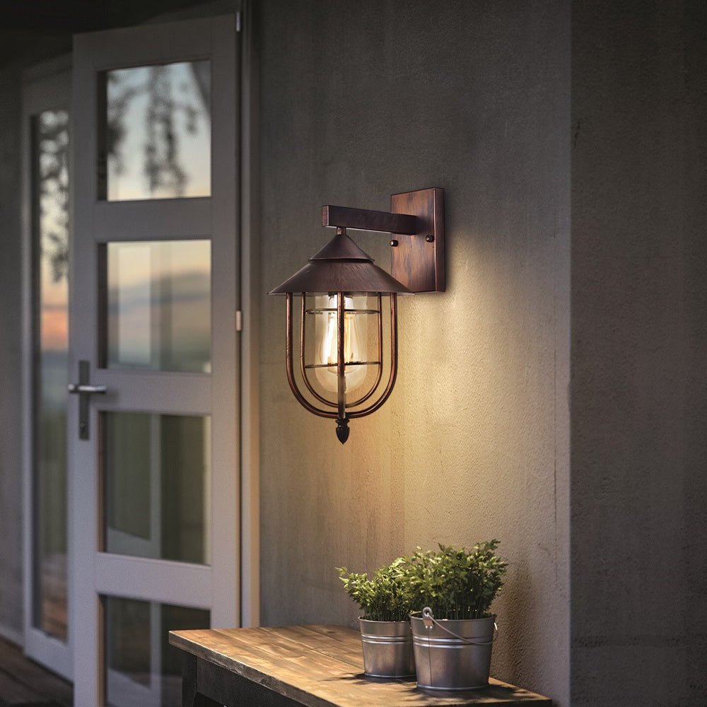 WINTERBOURNE RUSTIC IRON AND GLASS MOTION-ACTIVATED OUTDOOR WALL LANTERN