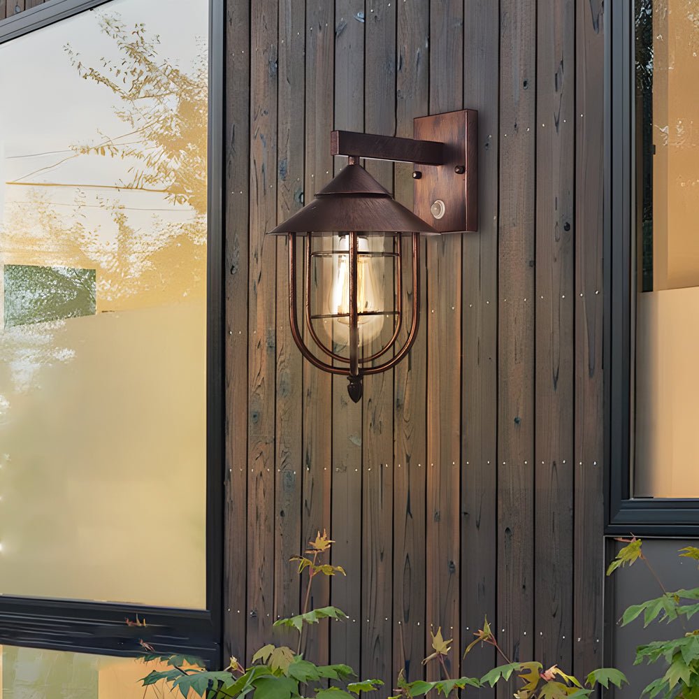 WINTERBOURNE RUSTIC IRON AND GLASS MOTION-ACTIVATED OUTDOOR WALL LANTERN